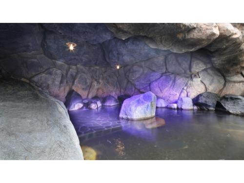 a cave with a rock in the water at Kutsurogi no Yado Juraku - Vacation STAY 03506v in Tobe