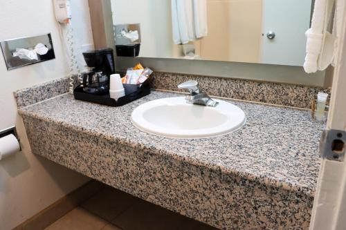 a bathroom counter with a sink in a hotel room at Driftwood in Santa Clara