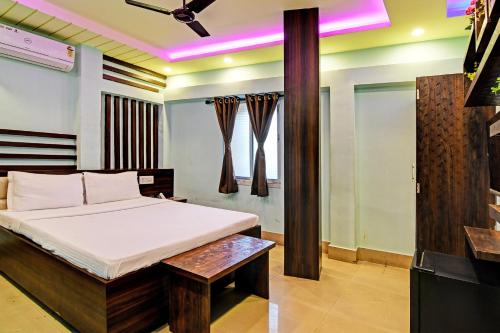 Ένα ή περισσότερα κρεβάτια σε δωμάτιο στο Super Hotel O The Orchid Residency
