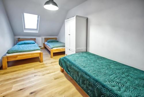 Posteľ alebo postele v izbe v ubytovaní Vila Ochutnej Pálavu