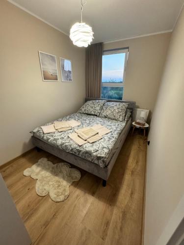 Katil atau katil-katil dalam bilik di Apartamenty RAJ przy Onkologii