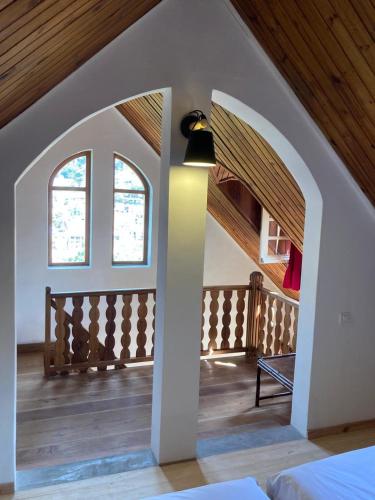 a bedroom with an archway in a house at Tsara Guest House in Fianarantsoa
