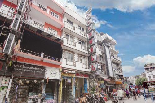 a group of buildings on a busy city street at Hotel All Iz Well - Traveller Choice Award winner 2025 in New Delhi