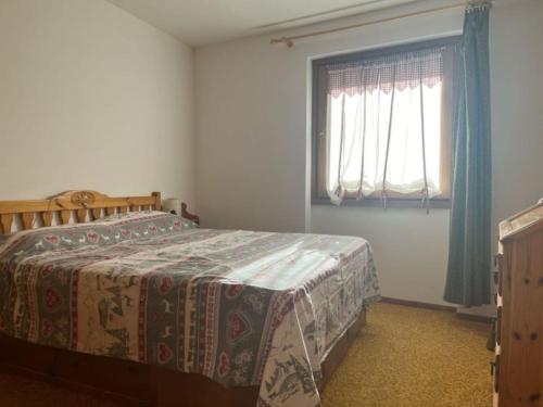 Postel nebo postele na pokoji v ubytování Casa Camos Cervinia