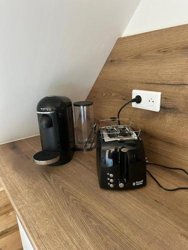 a toaster and a blender sitting on a counter at Nuits en Alsace in Morsbronn-les-Bains