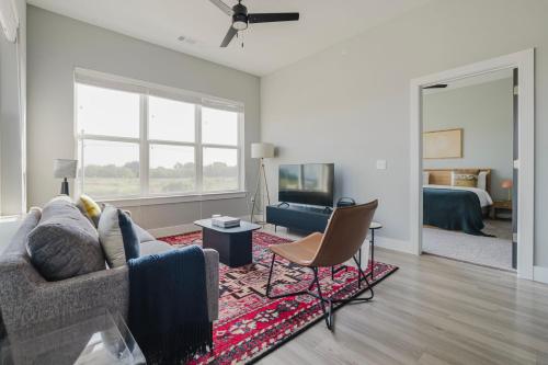 a living room with a couch and a bed at Blueground Lost Plains pool pet area wd ATX-271 in Austin