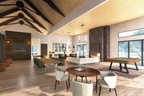 a living room with tables and chairs and a dining room at Blueground Lost Plains pool pet area wd ATX-271 in Austin