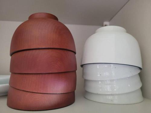 two brown and white lamps next to each other at 小浜島 182号棟 in Kohama