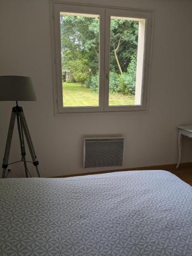 Ένα ή περισσότερα κρεβάτια σε δωμάτιο στο Chambre près de la mer