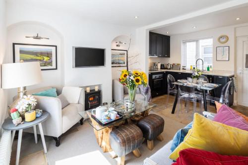 a living room with a couch and a table at Host & Stay - Voyagers' View in Whitby