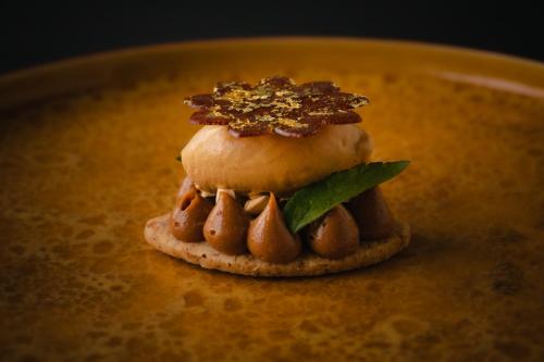 a small dessert on top of a plate at Auberge eaufeu in Komatsu