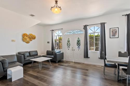 a living room with a couch and chairs and a table at Lovely gated 3bedroom & 2 bath unit near Universal studio and Hollywood in North Hollywood