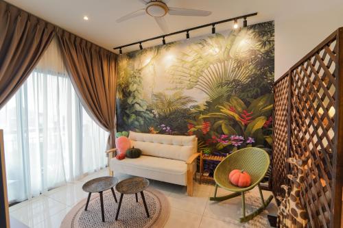 a living room with a couch and a mural at Horizon Ipoh 8Pax 3R2B - Tropical Bali Retreat in Ipoh