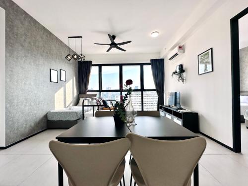 a living room with a dining room table and chairs at View of the whole Georgetown in George Town