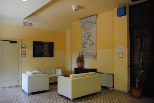 TV a/nebo společenská místnost v ubytování Sacro Cuore Hotel