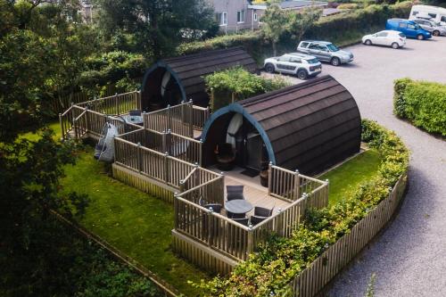 a group of huts on the grass in a parking lot at The Kellbank in Gosforth
