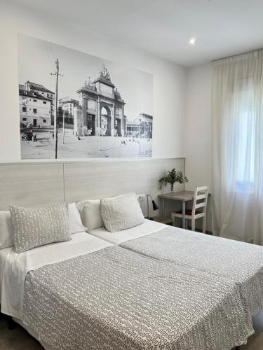 Postel nebo postele na pokoji v ubytování Hostal San Lorenzo