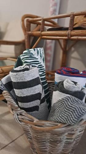 a basket filled with different types of socks at The Wooden Anchor spacious and modern in Zinkwazi Beach
