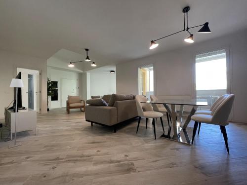 a living room with a couch and a table at Gli Scogli Luxury Residence Hotel in Chiavari