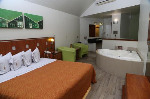 Ein Bett oder Betten in einem Zimmer der Unterkunft Autohotel VERSALLES