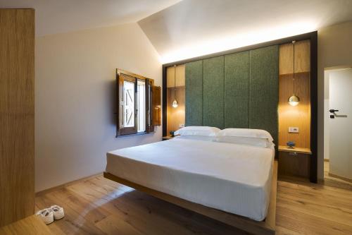 Postel nebo postele na pokoji v ubytování Gebel House