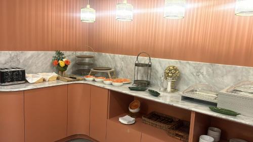a kitchen with a counter with food on it at King Charles Hotel in Valletta