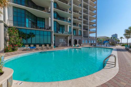 a large swimming pool in front of a building at The Oasis at Orange Beach 2203 in Orange Beach