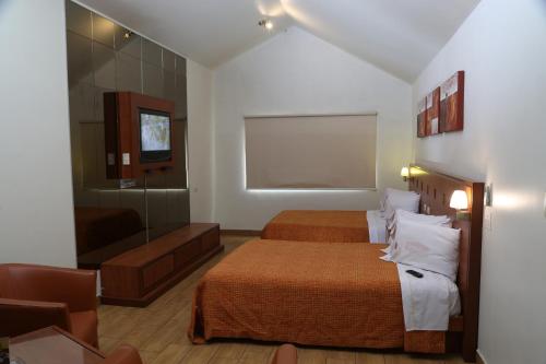 Ein Bett oder Betten in einem Zimmer der Unterkunft Autohotel VERSALLES