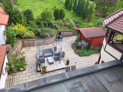 an aerial view of a garden with a swing at Hotel Schönblick in Bad Herrenalb