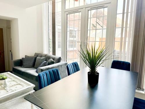 a living room with a table and a couch at Middleton Chambers by Guestz in Hull
