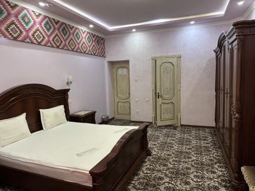 Postel nebo postele na pokoji v ubytování Mahruz HOTEL