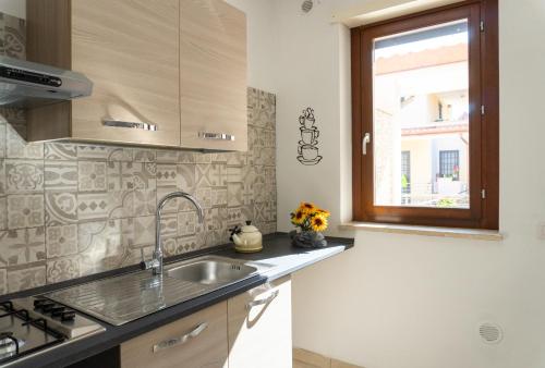 Η κουζίνα ή μικρή κουζίνα στο Alloggi Borgo Roma