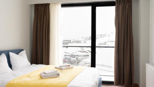 Postel nebo postele na pokoji v ubytování Gudauri Ski Resort - Twins Apartments