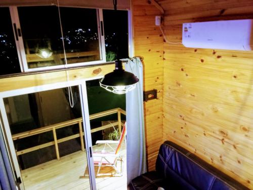 an outside view of a tiny house with a porch at Linda cabaña con excelente vista panorámica in Piriápolis