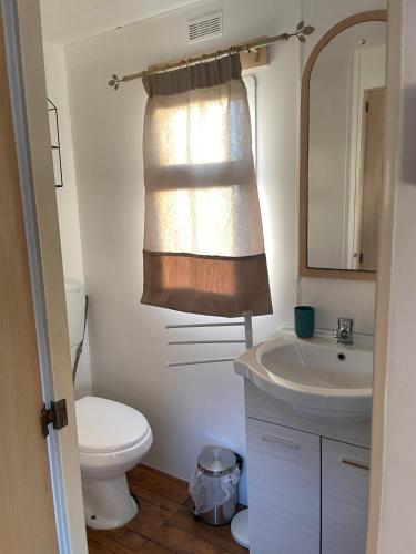 a bathroom with a toilet and a sink at Casa vacanze Trinacria in Menfi