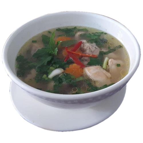 a white bowl of soup on a white plate at Naraya Guesthouse in Phnom Penh
