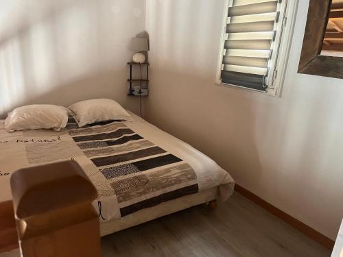 Ένα ή περισσότερα κρεβάτια σε δωμάτιο στο Chambres Hôtes chez Chris