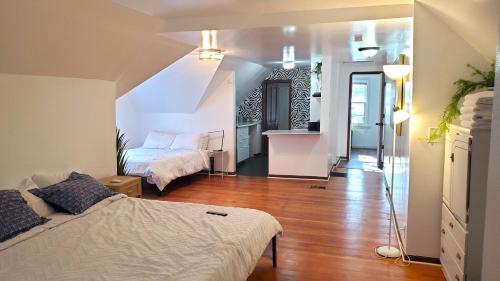 a living room with a bed and a staircase at Ana Maria del Azul in Minneapolis