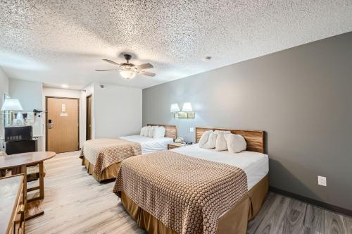 Ένα ή περισσότερα κρεβάτια σε δωμάτιο στο Travelodge by Wyndham Longmont