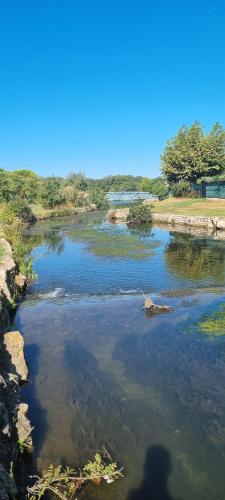 a shadow of a person standing in a river at Villa accueillante entre Aix et Marseille in Vitrolles
