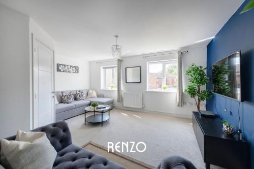 a living room with a couch and a table at Gorgeous 4-bed Home in Nottingham by Renzo, Free Driveway Parking, Great Location! in Nottingham