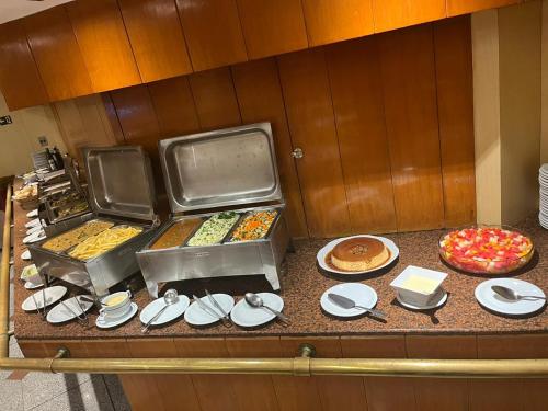 a buffet line with many different types of food at Hotel Atlantico Star in Rio de Janeiro