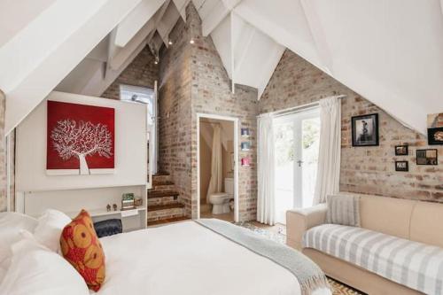 Ένα ή περισσότερα κρεβάτια σε δωμάτιο στο The Loft at 33