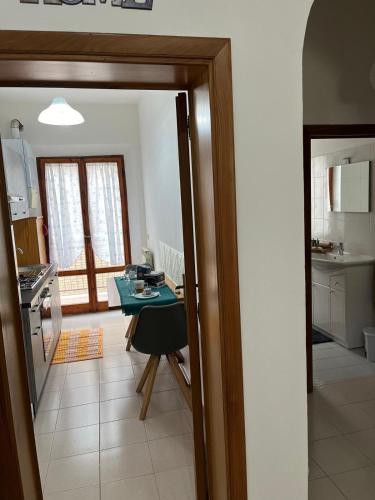 a kitchen with a table and a small table in a room at La Casina di Ezio in Montepulciano