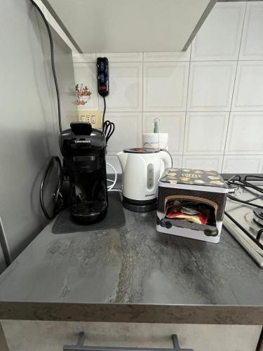 a kitchen counter with a coffee maker and a toaster at La Casina di Ezio in Montepulciano