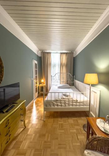 Ένα ή περισσότερα κρεβάτια σε δωμάτιο στο Hotel-Maison Am Olivaer Platz