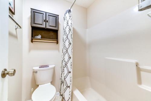 a bathroom with a toilet and a shower at Little River Condo with Pool Access 5 Mi to Beach in Little River