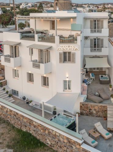 an aerial view of a building with a swimming pool at Ostria Hotel  in Adamas