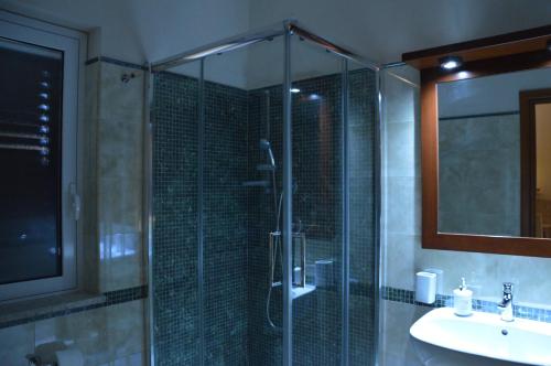 a bathroom with a shower and a sink at B&B e Casa Vacanza al Castello in Roccella Ionica