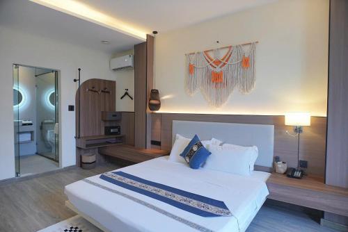 Postel nebo postele na pokoji v ubytování Amy Hotel